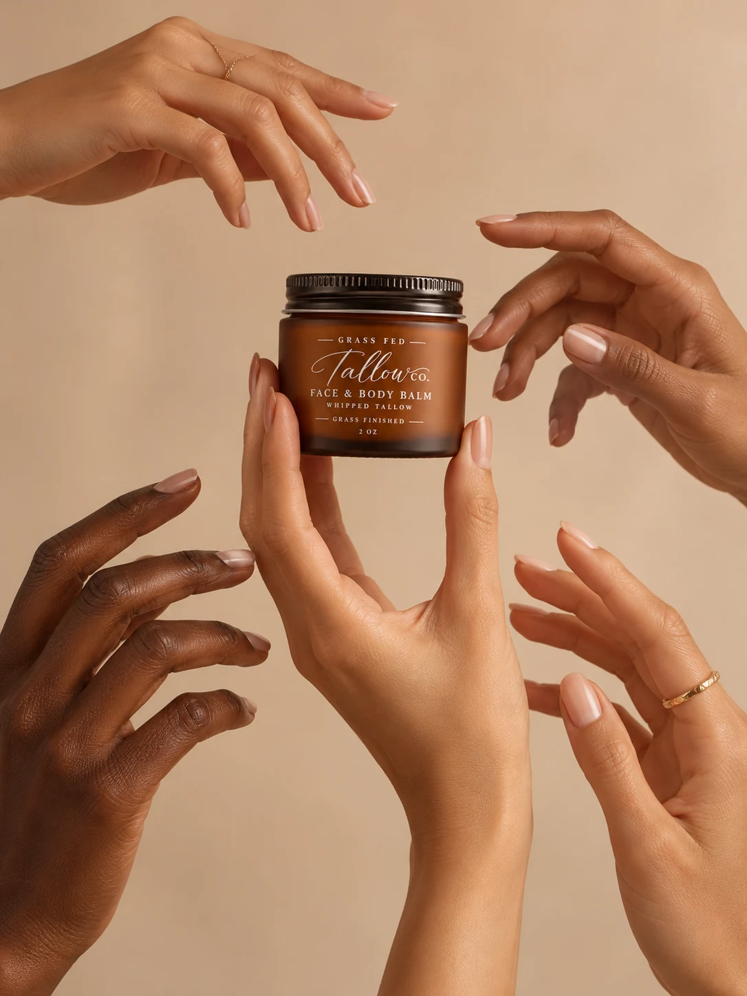 Several hands surrounding an amber face and body balm jar.